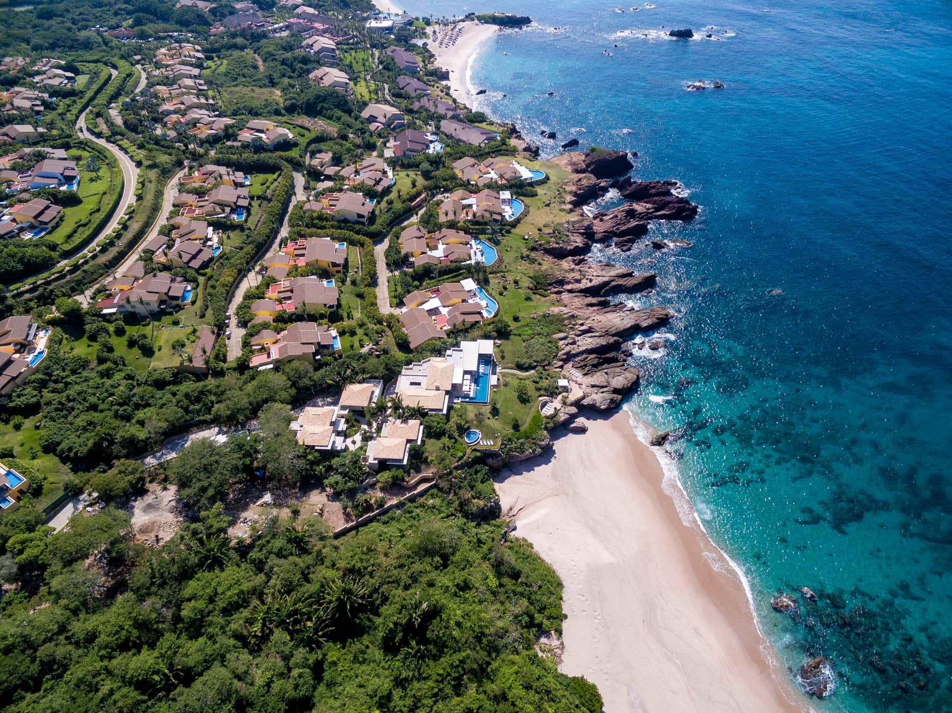 Punta de Mita: the rocky coast, a cove and turquoise water from the air
