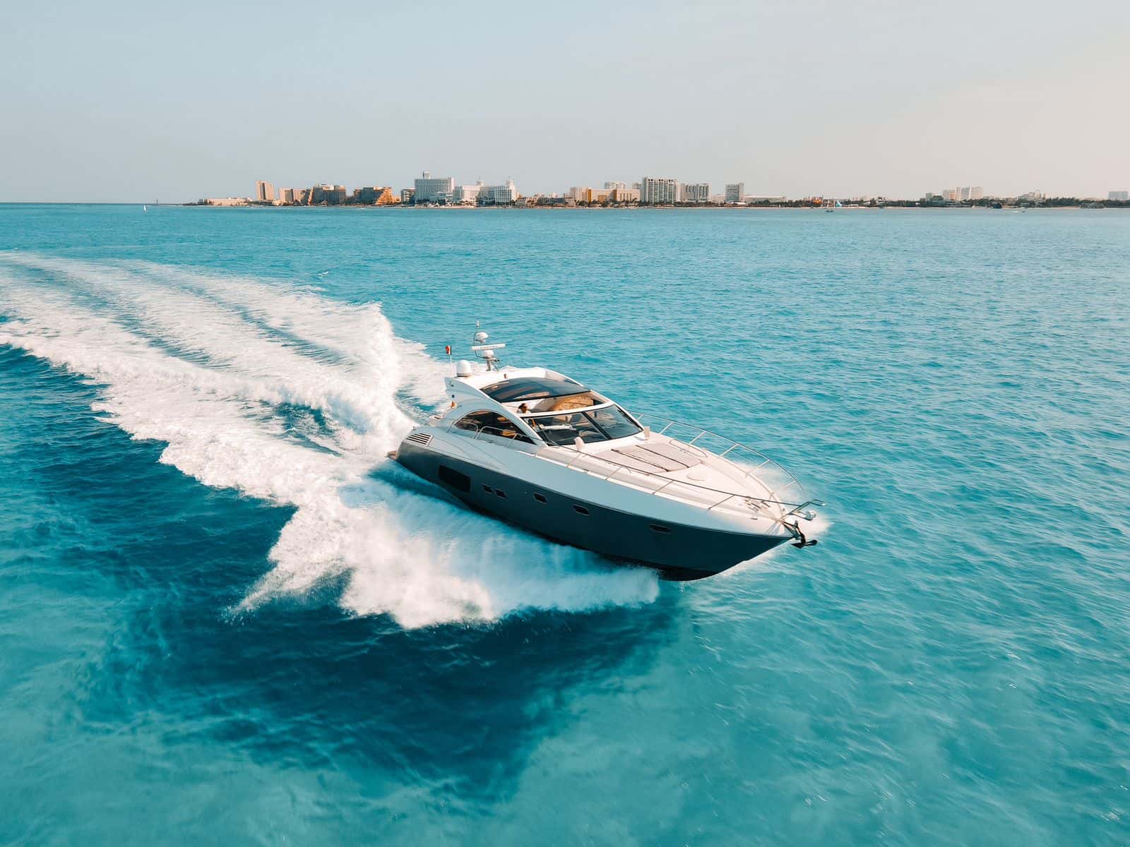 Tatabu under way at speed with the Cancun hotel zone behind