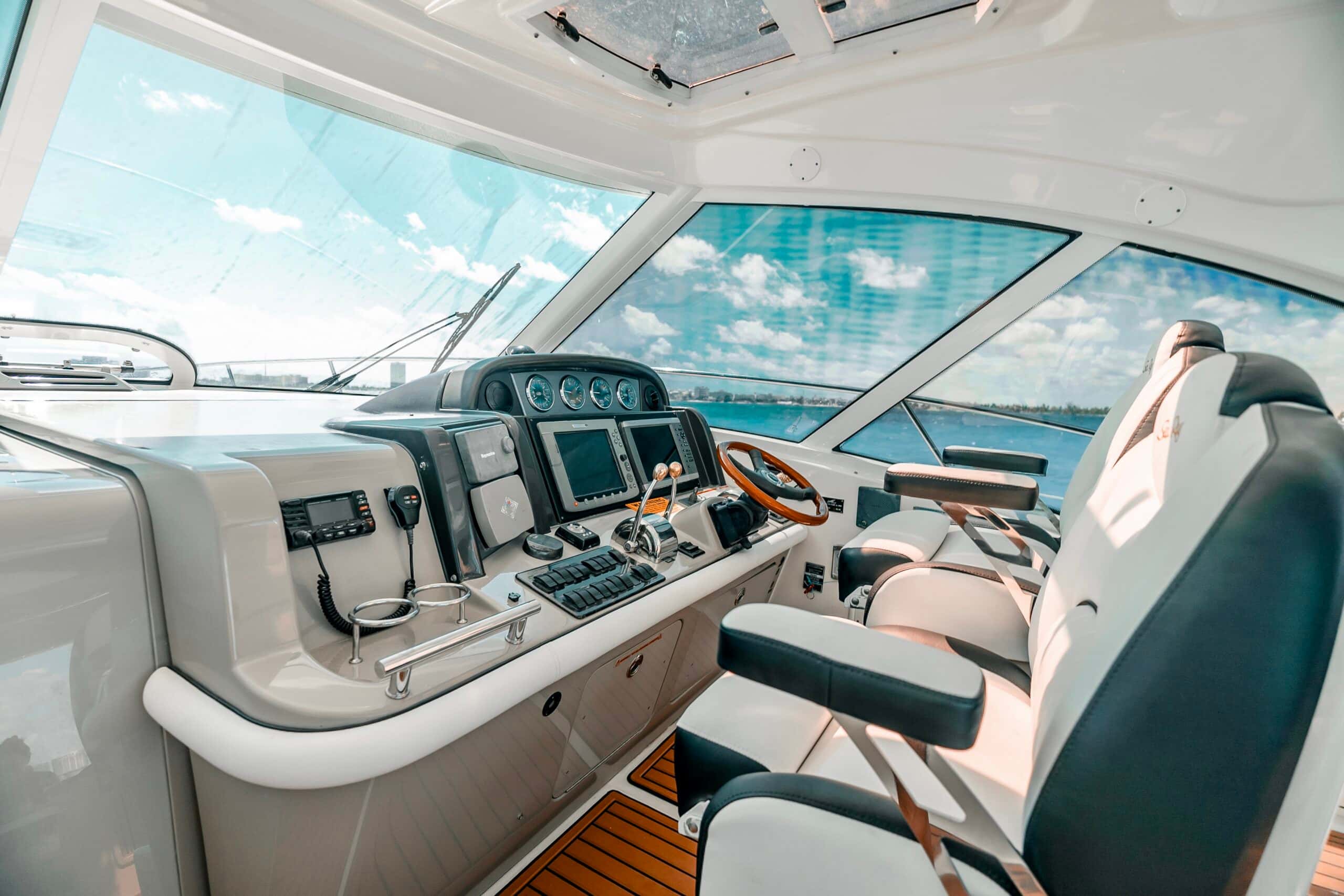 Helm with twin captain's seats, wheel and electronics under the hardtop