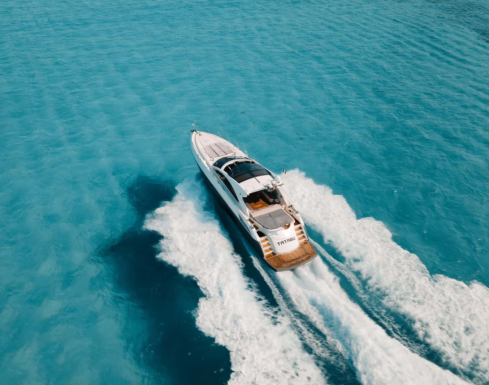 Aerial view of Tatabu under way, trailing her wake