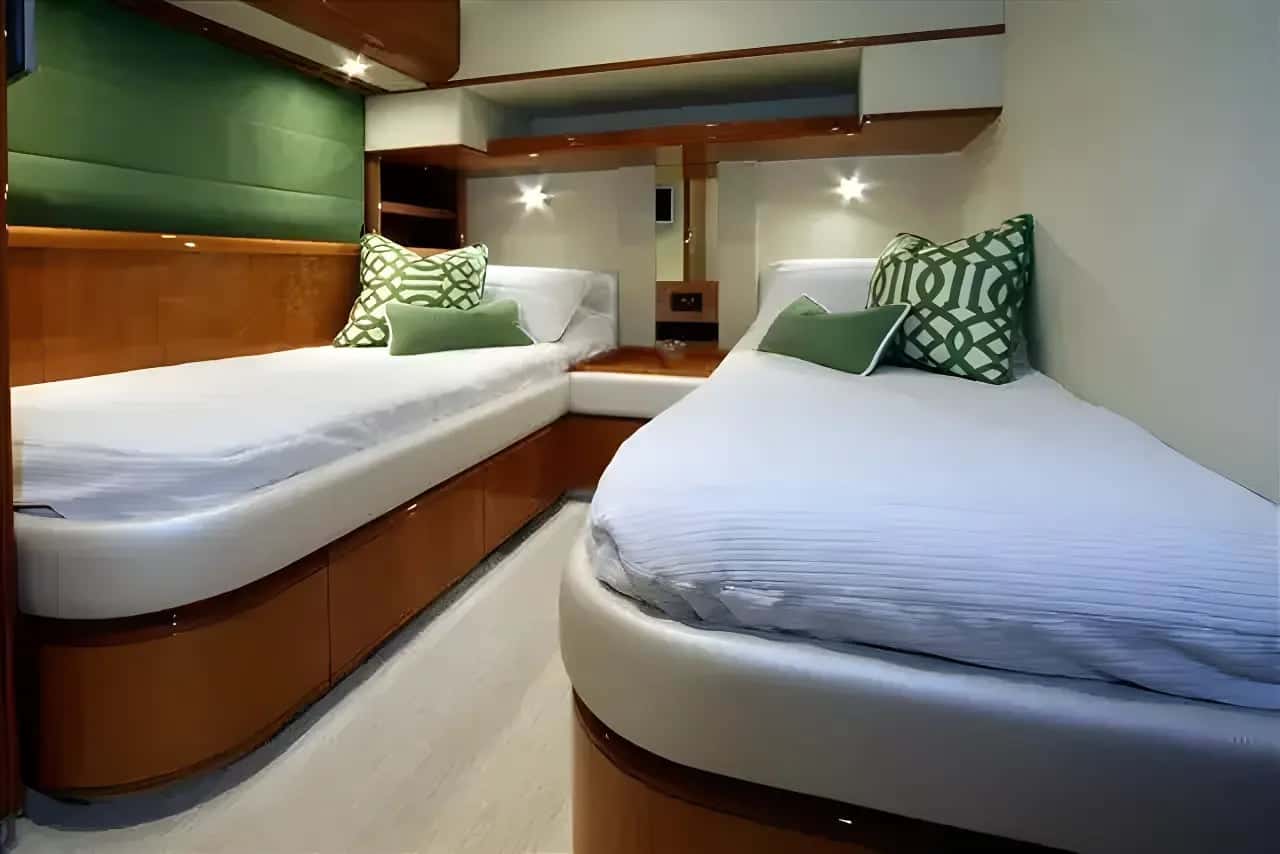 Twin cabin of another Ferretti 760 with two single beds and wood joinery