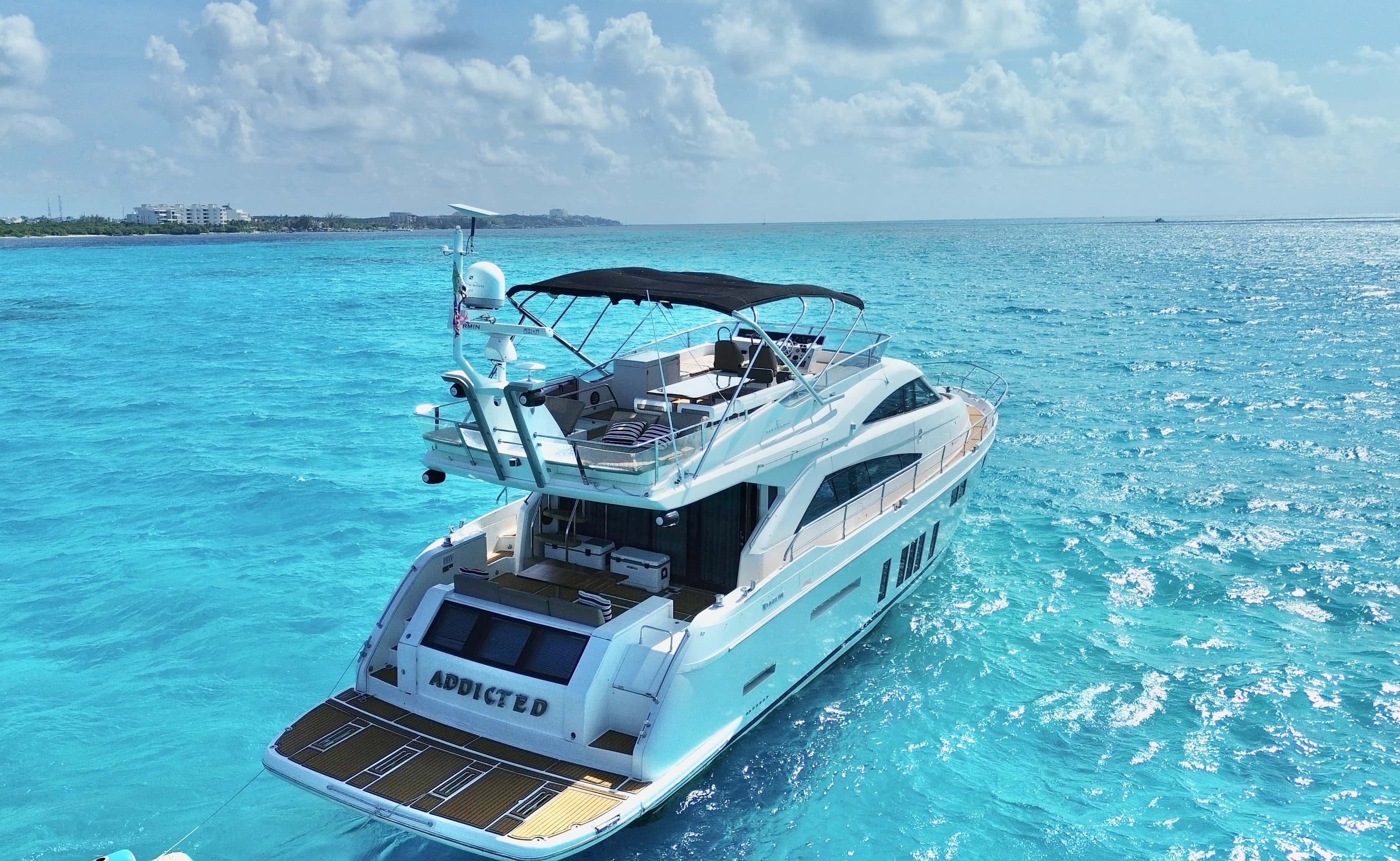 Aerial view of Addicted from astern with the name on the transom, the cockpit and the flybridge
