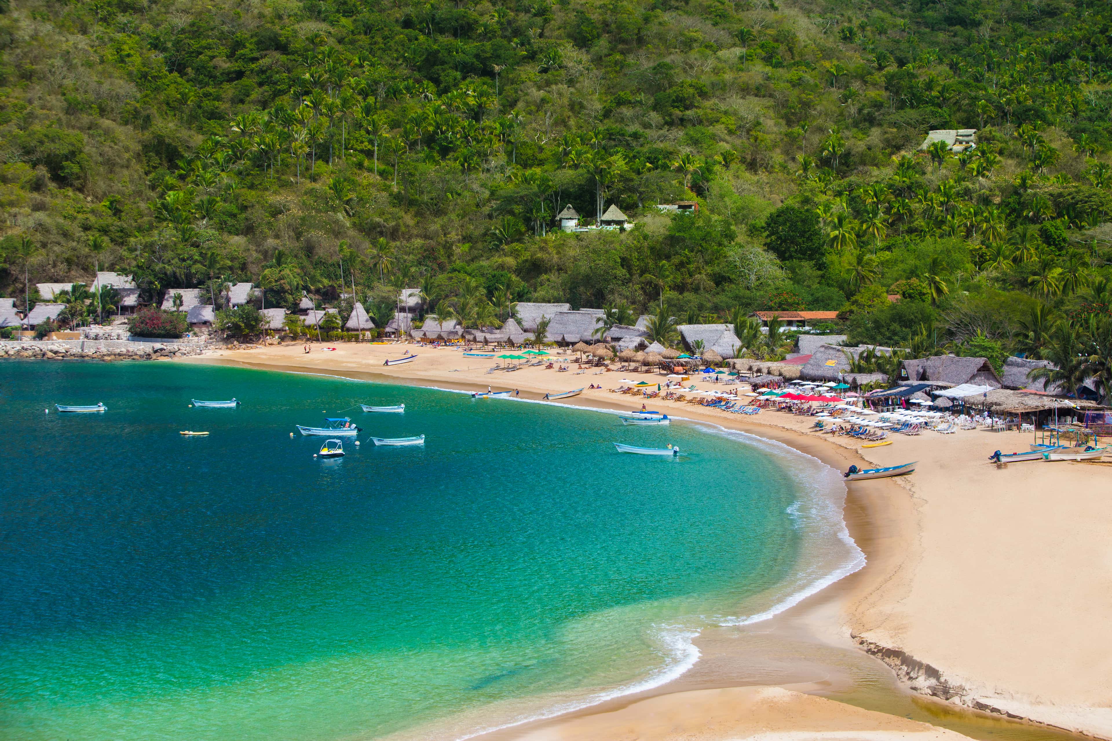 Yelapa: the cove's beach, boats at anchor and the jungle behind