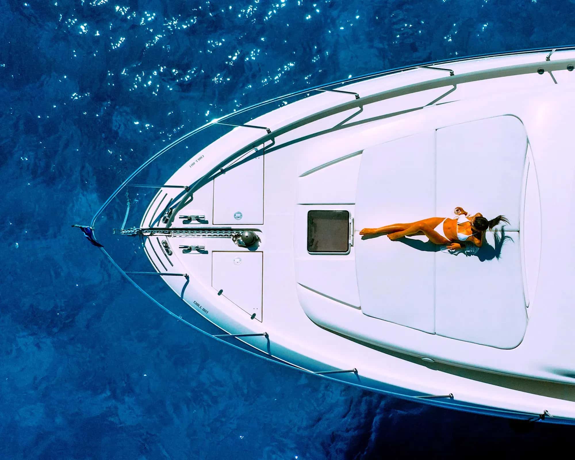 Aerial view of a private yacht on blue water