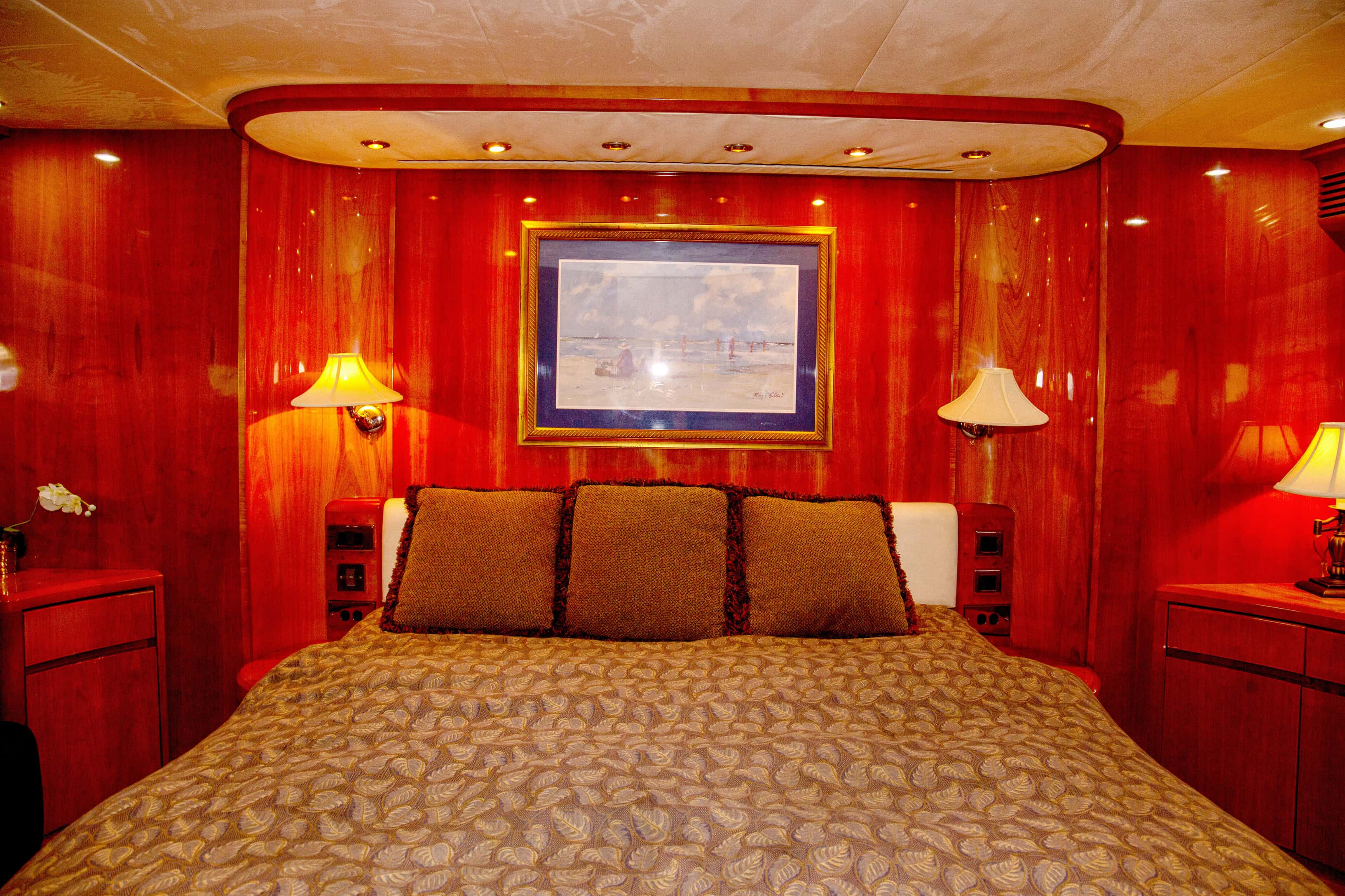 Master cabin with cherry joinery and a double bed