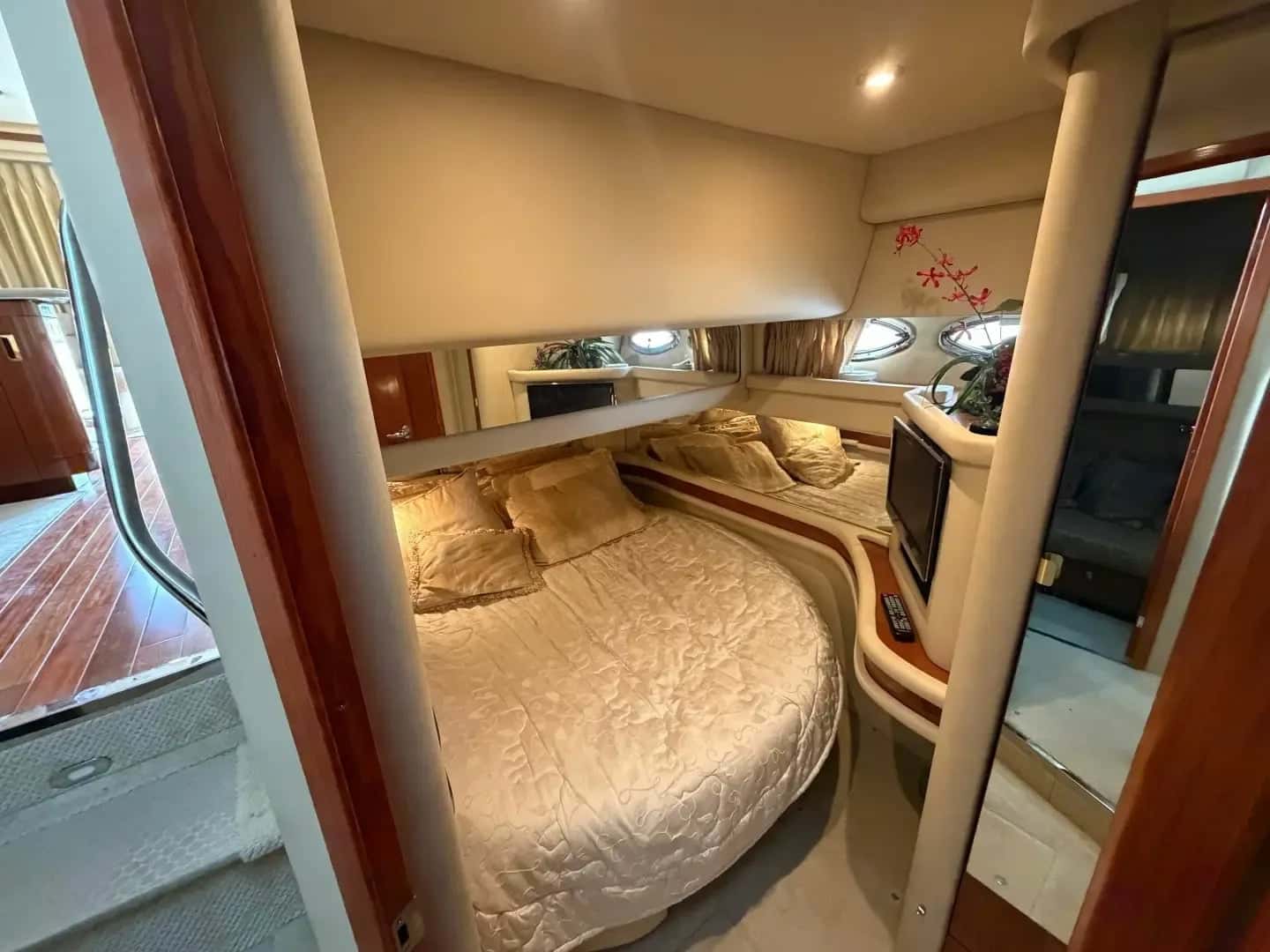 Guest cabin of another Sea Ray 480 Sedan Bridge with a double bed and cherry joinery