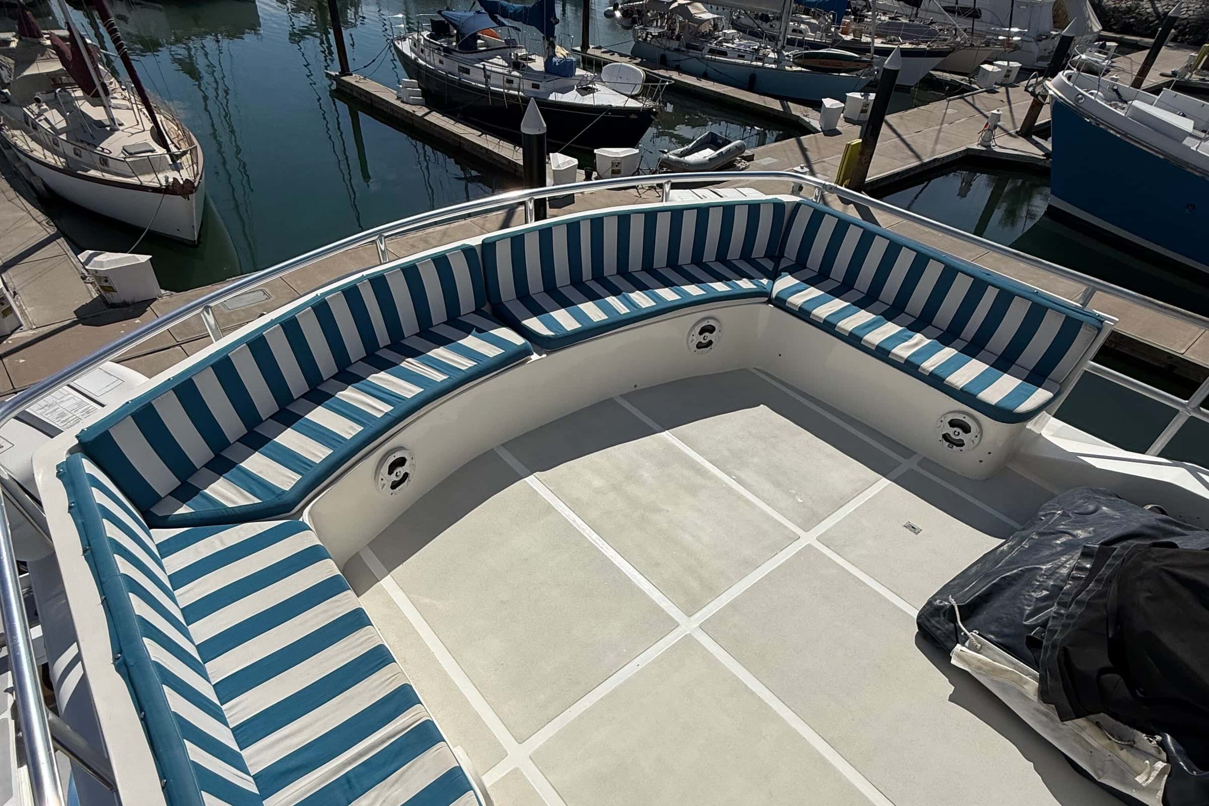 The striped U-shaped settee at the aft end of the flybridge