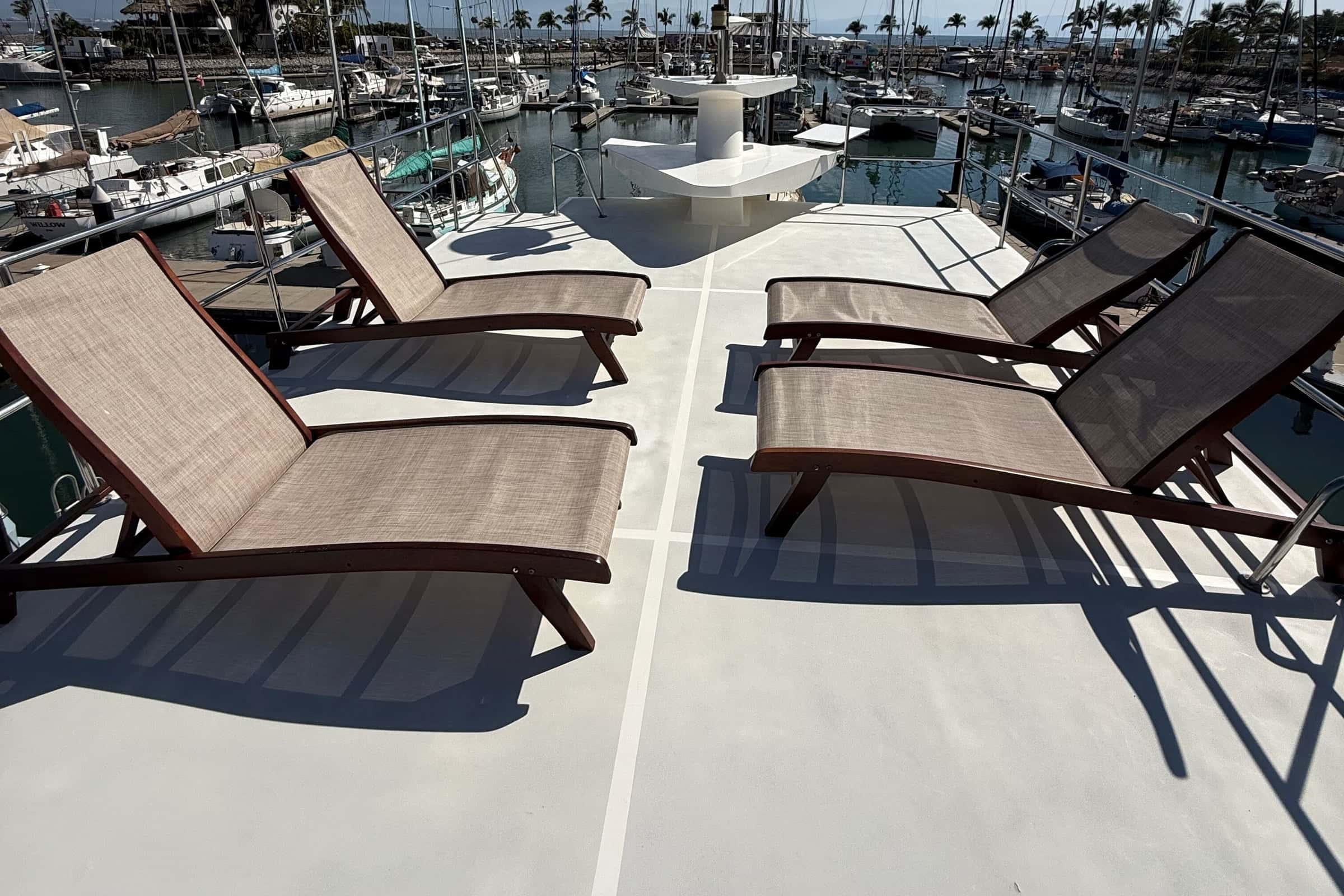 Loungers on the open sky deck on top of the yacht